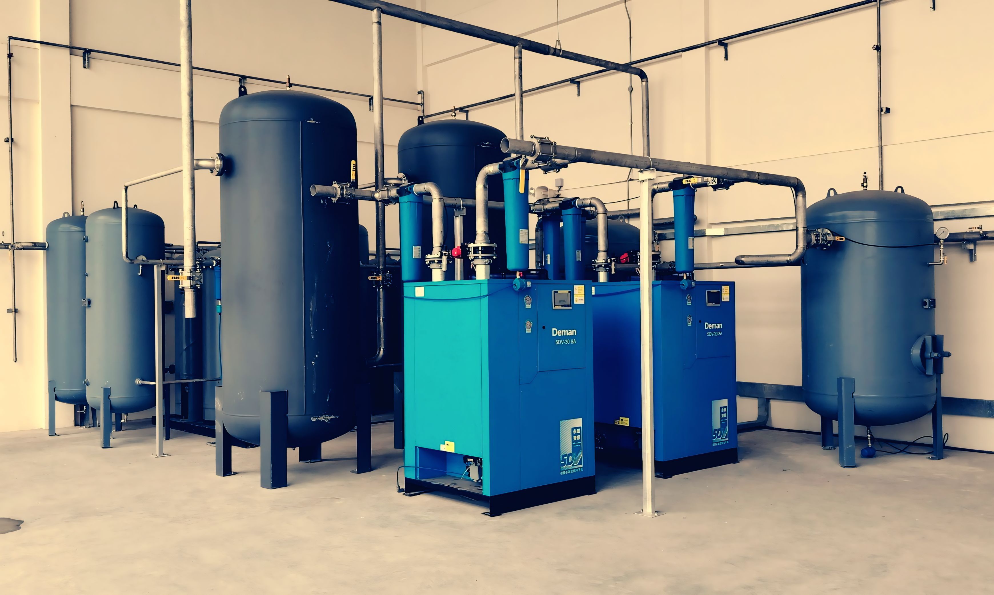 Yellow-coded pump station valves and piping ready for installation