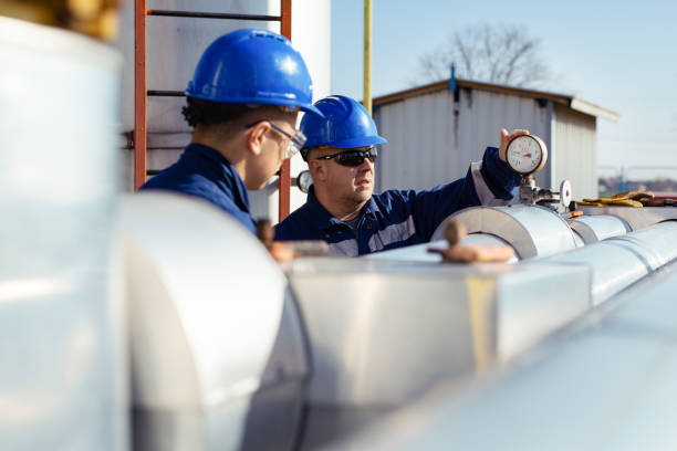 Field engineer reviewing pipeline documentation